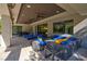 Spacious covered patio with comfortable seating and ceiling fans for outdoor living at 43 Grey Feather Dr, Las Vegas, NV 89135