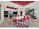 Bright dining room with seating for 8, elegant chandelier, and modern decor at 43 Grey Feather Dr, Las Vegas, NV 89135