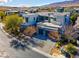 Modern two-story home with a paver driveway and mature landscaping at 43 Grey Feather Dr, Las Vegas, NV 89135