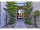 Beautiful modern front door framed by lush greenery at 43 Grey Feather Dr, Las Vegas, NV 89135