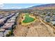 View of a well-manicured golf course amidst a residential community, showcasing a vibrant and active lifestyle at 43 Grey Feather Dr, Las Vegas, NV 89135