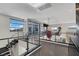 A hallway with glass railings and a view of the living room below at 43 Grey Feather Dr, Las Vegas, NV 89135