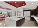 Bright, open kitchen with a large island, stainless steel appliances, and modern lighting at 43 Grey Feather Dr, Las Vegas, NV 89135