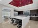 Spacious kitchen with stainless steel appliances, island seating, and sleek dark cabinets at 43 Grey Feather Dr, Las Vegas, NV 89135