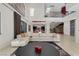 Spacious living room with high ceilings, modern decor, and open staircase at 43 Grey Feather Dr, Las Vegas, NV 89135