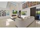 Bright living room featuring stone fireplace, modern decor, and tile flooring at 43 Grey Feather Dr, Las Vegas, NV 89135
