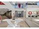 Bright open-concept living room with floating staircase and modern decor at 43 Grey Feather Dr, Las Vegas, NV 89135