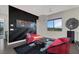Stylish loft with comfortable seating, statement art, and plenty of natural light at 43 Grey Feather Dr, Las Vegas, NV 89135