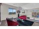 Cozy loft featuring stylish seating, modern decor, and large windows at 43 Grey Feather Dr, Las Vegas, NV 89135