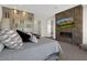 Spacious main bedroom features modern decor, a fireplace with TV, and ample natural light at 43 Grey Feather Dr, Las Vegas, NV 89135