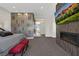 Luxurious main bedroom with modern fireplace, TV, and sitting area with high end decor at 43 Grey Feather Dr, Las Vegas, NV 89135