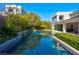 Sparkling backyard pool with lush landscaping and serene water features at 43 Grey Feather Dr, Las Vegas, NV 89135