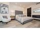 Comfortable bedroom featuring a tufted headboard, fireplace, and modern furnishings at 4575 Dean Martin Dr # 2400, Las Vegas, NV 89103