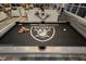 Stylish game room featuring a Raiders-themed pool table and city views at 4575 Dean Martin Dr # 2400, Las Vegas, NV 89103