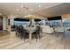 Open-concept living area with modern dining table and expansive windows with a city view at 4575 Dean Martin Dr # 2400, Las Vegas, NV 89103
