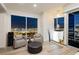 Comfortable sitting area with city views, a modern design, and gray upholstered chairs at 4575 Dean Martin Dr # 2400, Las Vegas, NV 89103