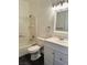 Well-lit bathroom with tiled shower-tub and a white vanity with updated fixtures at 4730 E Craig Rd # 1172, Las Vegas, NV 89115