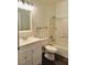 Bathroom with white cabinets, tile shower over tub, and gray tile floor at 4730 E Craig Rd # 1172, Las Vegas, NV 89115