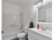 Clean bathroom featuring tiled shower-tub combination and a vanity with a large mirror at 4730 E Craig Rd # 1172, Las Vegas, NV 89115