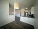 Bright kitchen area featuring stainless steel appliances, stone countertops, and modern lighting at 4730 E Craig Rd # 1172, Las Vegas, NV 89115