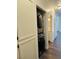 Laundry closet with gray stacked washer and dryer next to hallway at 4730 E Craig Rd # 1172, Las Vegas, NV 89115