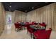 Fun karaoke room with gold curtains, marble tables with seating and tile flooring at 48 Augusta Canyon Way, Las Vegas, NV 89141