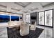 This luxury living room boasts a fireplace, modern lighting, and a view of the pool at 48 Augusta Canyon Way, Las Vegas, NV 89141