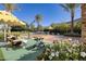 Outdoor pickleball court surrounded by landscaping and lounge seating at 48 Augusta Canyon Way, Las Vegas, NV 89141