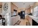 Well-lit kitchen with stainless steel appliances, light wood cabinets and tile countertops at 533 Tuscany View St, Las Vegas, NV 89145