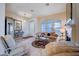 Bright living room with large windows, neutral tones, fireplace, and elegant decor at 533 Tuscany View St, Las Vegas, NV 89145