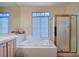 Bright main bathroom featuring a large soaking tub and separate glass shower at 533 Tuscany View St, Las Vegas, NV 89145