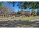 Neighborhood playground with picnic tables, mature shade tree, slides, and water features at 5465 Buckeye Lake St, Las Vegas, NV 89122