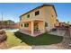 Two-story home featuring an inviting backyard with a covered patio and private pool at 58 Desert Castle Ct, Henderson, NV 89012