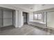 Bathroom featuring a walk-in closet, soaking tub, shower, and gray wood-look flooring at 58 Desert Castle Ct, Henderson, NV 89012