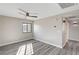 Clean bedroom with wood-look flooring, a ceiling fan, and natural light from a window at 58 Desert Castle Ct, Henderson, NV 89012