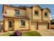 Charming two-story stucco home with a two-car garage and an American flag waving out front at 58 Desert Castle Ct, Henderson, NV 89012