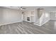 Spacious living area showcasing wood-look floors, a fireplace, and staircase at 58 Desert Castle Ct, Henderson, NV 89012
