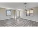 Inviting living room featuring modern gray wood floors, neutral walls, and natural light at 58 Desert Castle Ct, Henderson, NV 89012
