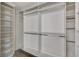 White walk-in closet with built-in shelving and hanging rods for optimal organization at 58 Desert Castle Ct, Henderson, NV 89012