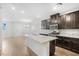 Bright kitchen with white granite island, stainless steel appliances, and seamless open-concept layout at 6462 Silver Estates St, North Las Vegas, NV 89081