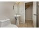 Bathroom featuring pedestal sink, tile floors, and neutral wall color at 6609 Pine Siskin Pl, North Las Vegas, NV 89084