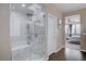 Stylish bathroom with a glass-enclosed shower, a comfortable bench, and tiled walls at 7195 Morningside Ranch Ct, Las Vegas, NV 89113