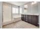 Bathroom featuring a glass enclosed shower, soaking tub and double sink vanity at 7203 Pepperbox Ave, Las Vegas, NV 89179