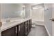 Bathroom with dual sink vanity, shower-tub combo, and modern fixtures at 7203 Pepperbox Ave, Las Vegas, NV 89179