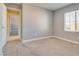 Bedroom featuring carpet, natural light and a partial view into the hall at 7203 Pepperbox Ave, Las Vegas, NV 89179