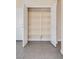 Open shelving and storage with double doors in a tile floor at 7203 Pepperbox Ave, Las Vegas, NV 89179
