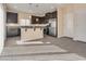 Eat-in kitchen showcasing dark cabinetry, stainless steel appliances and tile flooring at 7203 Pepperbox Ave, Las Vegas, NV 89179