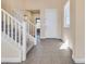 Welcoming foyer featuring tile flooring, staircase, and a bright front door that lets in ample light at 7203 Pepperbox Ave, Las Vegas, NV 89179