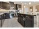 Kitchen with dark cabinets, stainless steel appliances, granite countertops, and tile flooring at 7203 Pepperbox Ave, Las Vegas, NV 89179
