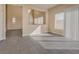 An open living room offers natural light and access to the adjacent rooms at 7203 Pepperbox Ave, Las Vegas, NV 89179